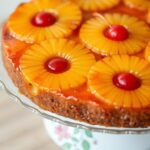 A classic pineapple upside-down cake with maraschino cherries